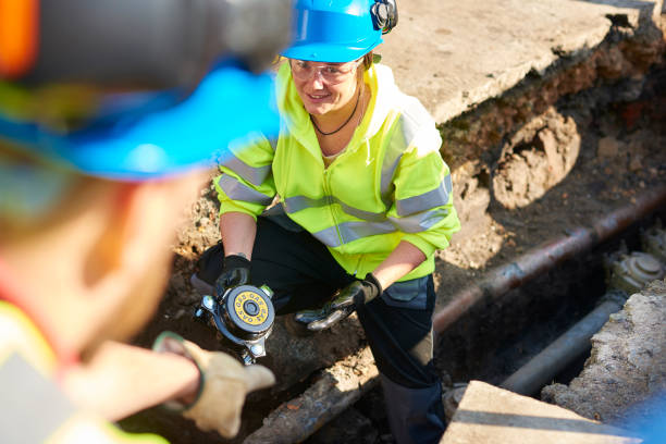 istock female civil engineer in gas trench 693623332
