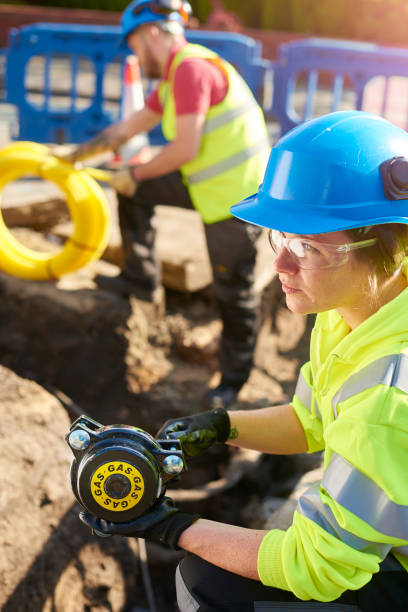 istock female gas engineer in trench 693623618