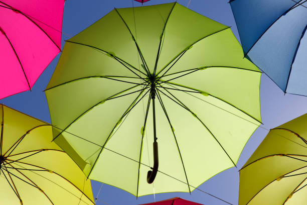 istock colorful umbrella on the sky 693623776