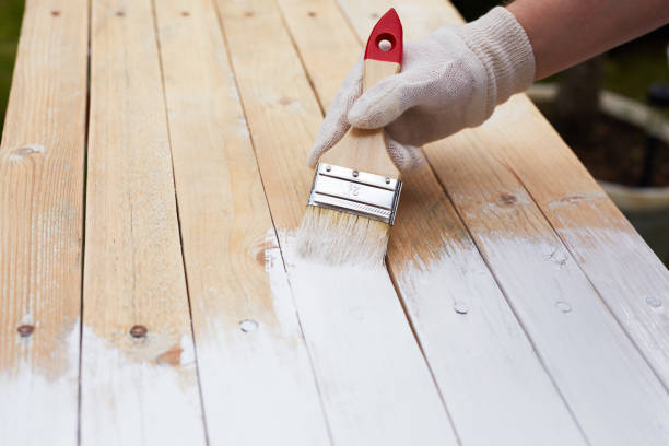 istock Close up paintbrush in male hand 693624436