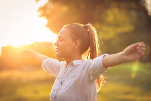 istock Breathing exercise in nature in sunset 693625254