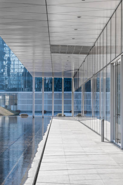 istock modern business building in financial district with empty square/pavement/space 693628292