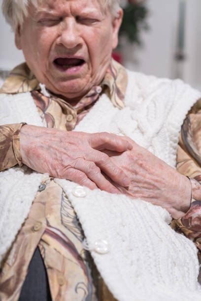 istock Senior woman suffering from heart attack 693633810