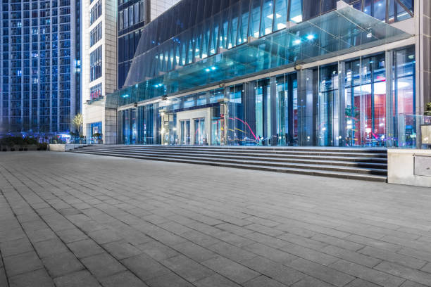 istock modern business building in financial district with empty square/pavement/space 693634812