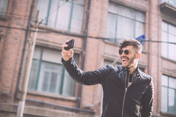 istock Man taking selfie with smartphone 693638164