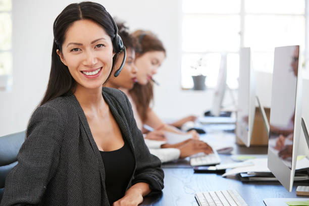istock Man and woman with documents in an office, smiling, close up 693646698