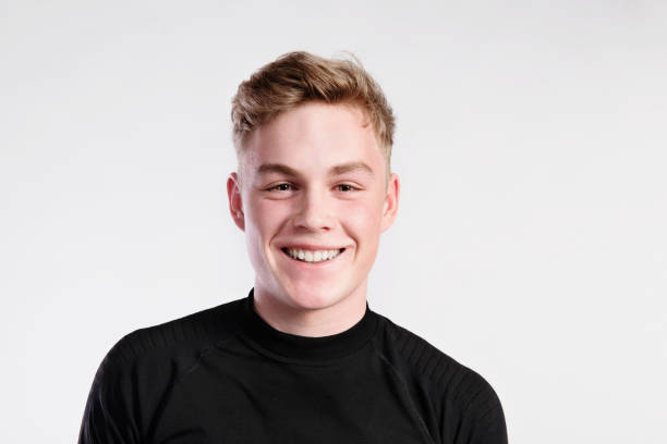 istock Young handsome hipster man in black t-shirt, studio shot. 693647862