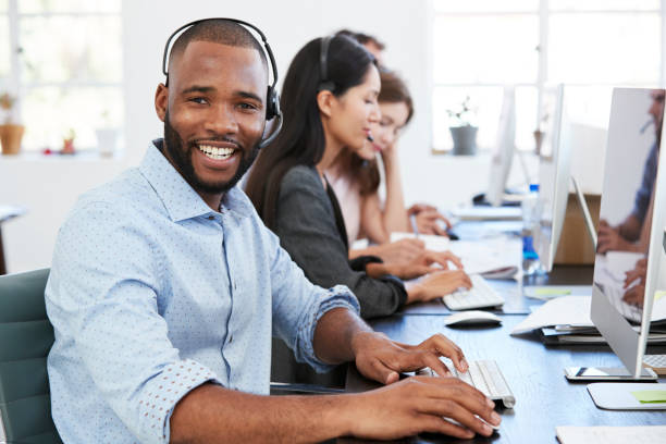 istock Man and woman with documents in an office, smiling, close up 693649034