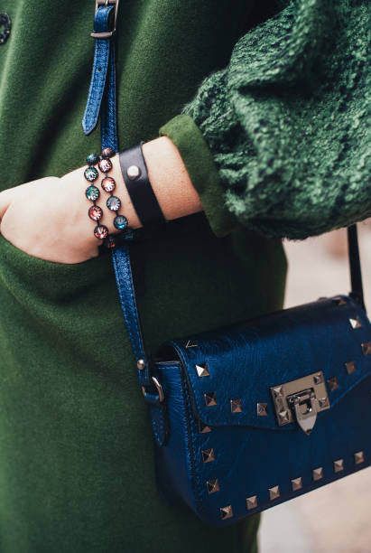 istock Girl holding a woman's bag in her hands 693649466