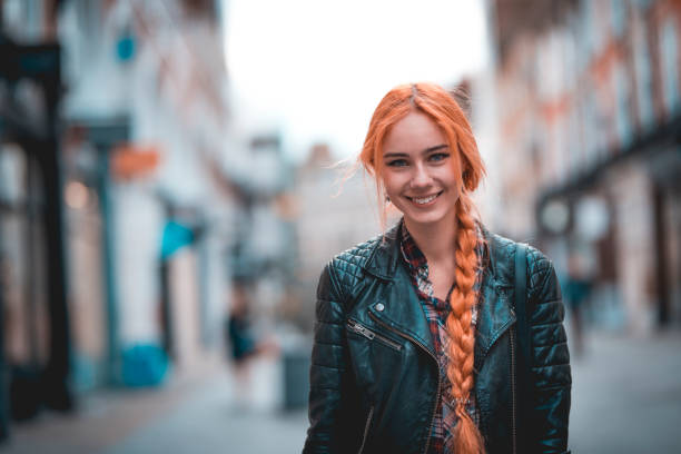 Waiting for friends Woman posing on the street in London. She is looking at camera. young women shopping stock pictures, royalty-free photos & images