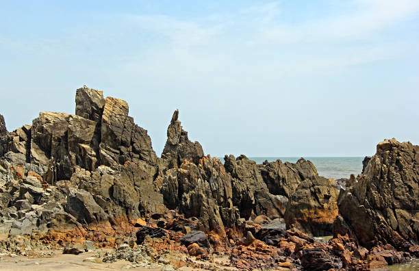 istock Rugged Coastline Arambol Beach in Goa India 693656722