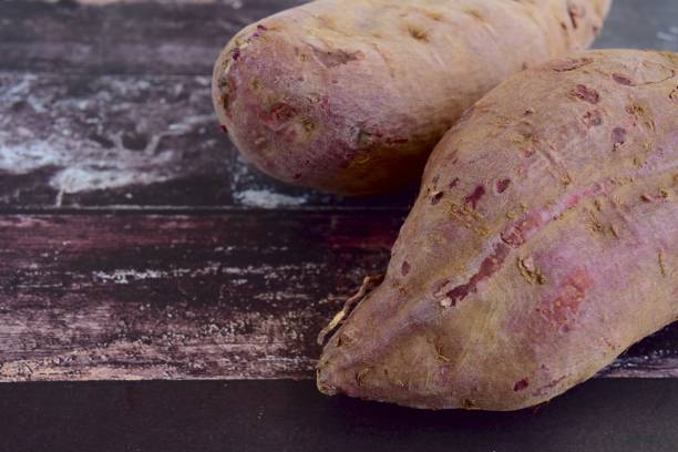 istock Raw purple sweet potatoes 693657018