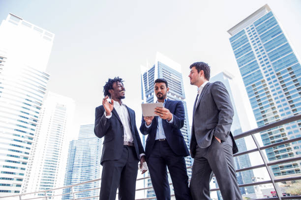 istock Businessmen having a conversation about work outside of the office 693665132