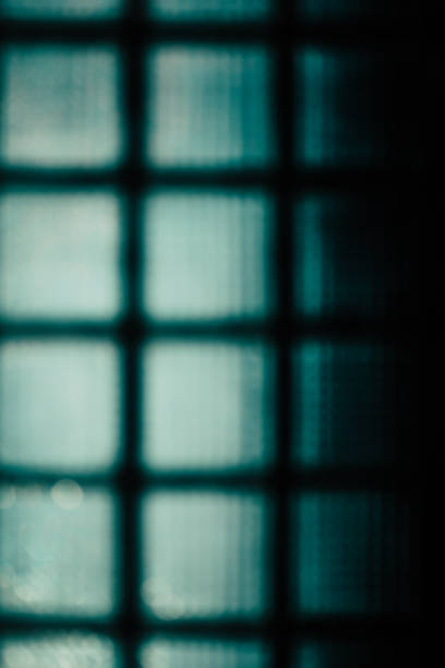 istock Green abstract blurred background. The wall of glass blocks 693668498