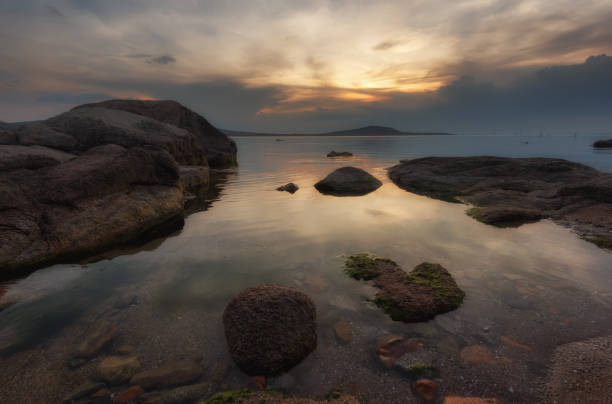 istock Magnificent cloudy sunset over the sea. Spring sunset, landscape, seascape. 693677626
