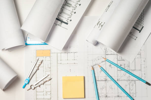 istock Workplace of architect - rolls and plans. 693678326