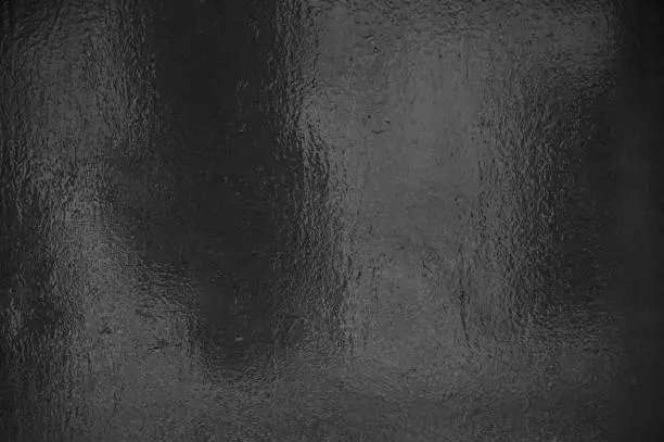 Photo of Black grey shiny foil background