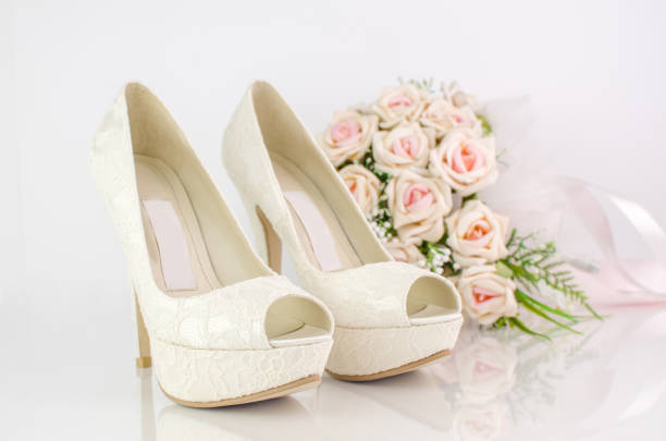 istock Wedding Bridal Shoes With Pink Roses 693681556