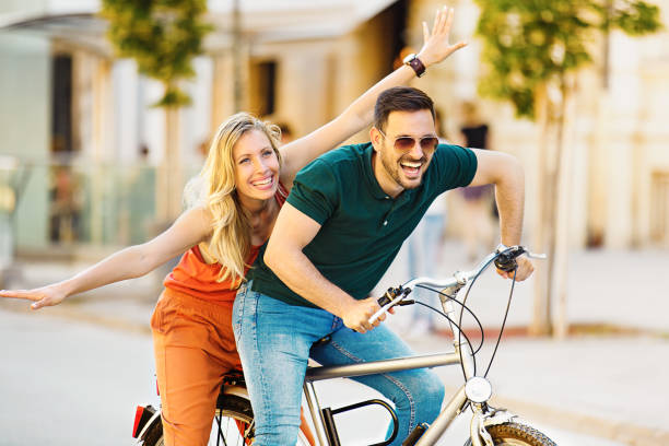 istock Love Couple Riding Bicycle 693682460