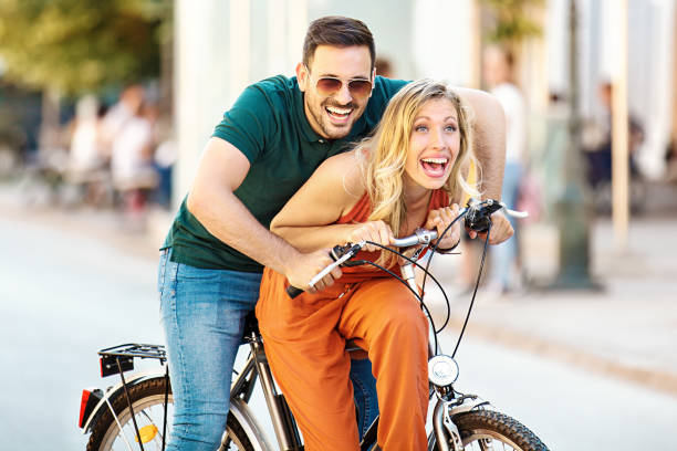 istock Love Couple Riding Bicycle 693682592