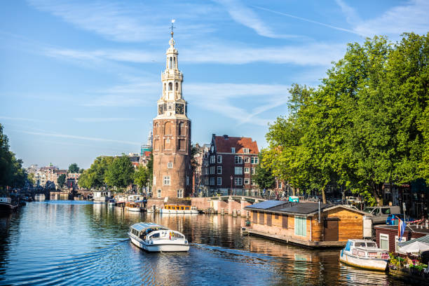 istock Amsterdam Canal with houseboats and ships 693682644