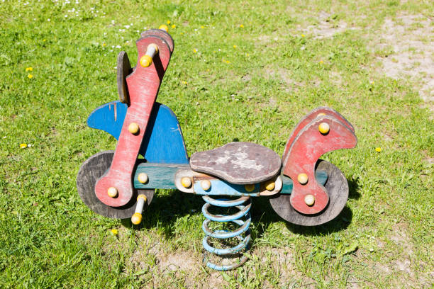 istock Empty wooden traditional swing on playground. 693682838