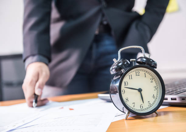 istock business, It's time to leave work but still busy 693683480