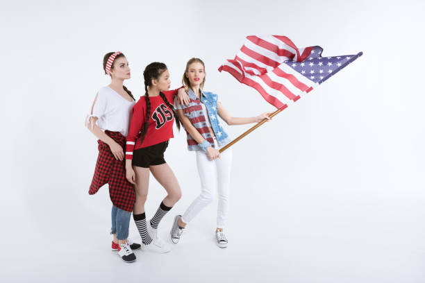istock girls posing with american flag isolated on white 693692062