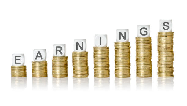 istock Coin stacks with letter dice - Earnings 693692130