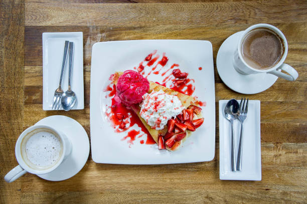 dessert ice cream strawberry crepe and hot drink in coffee shop - coffee time restaurant imagens e fotografias de stock