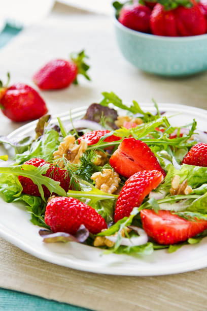 istock Strawberry with Walnut and Rocket salad by Balsamic dressing 693692772