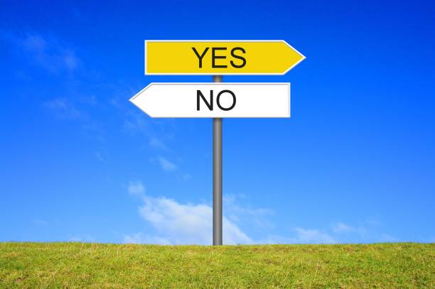 Signpost showing Yes or No Signpost outside is showing Yes or No guidance photos stock pictures, royalty-free photos & images