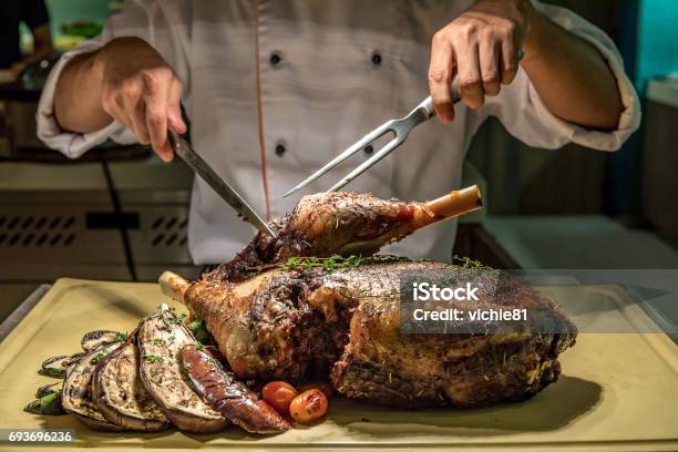 Carving Lamb Stock Photo - Download Image Now - Chef, Christmas, Carving Food