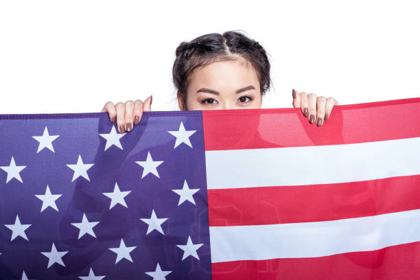 istock woman posing with american flag isolated on white 693696260