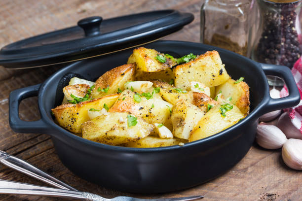 istock Baked potato, roasted potatoes with rosemary. Selective focus 693696724