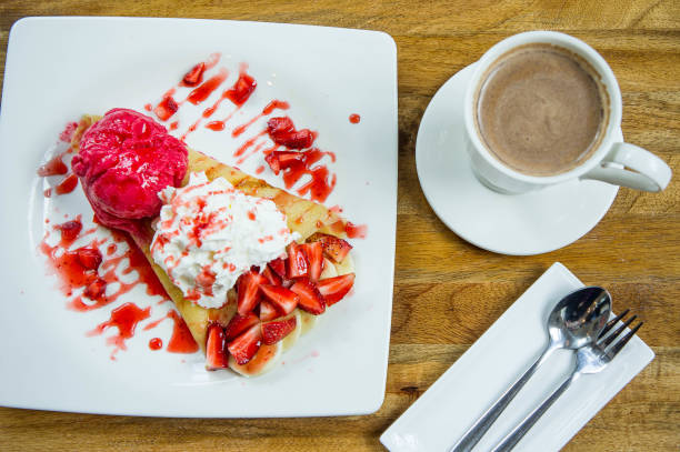 dessert ice cream strawberry crepe and hot drink in coffee shop - coffee time restaurant imagens e fotografias de stock