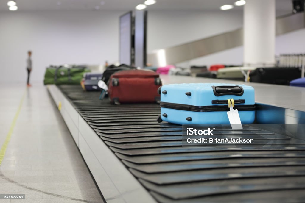 Suitcase or luggage on conveyor belt in the airport Suitcase or luggage on conveyor belt in the airport waiting Airport Stock Photo