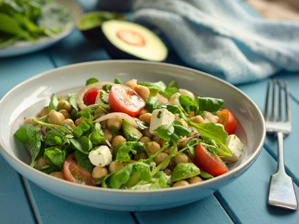 Healthy chickpea salad Home made chickpeas,cherry tomato and avocado,watercress salad with feta cheese and balsamic vinegar dressing watercress stock pictures, royalty-free photos & images