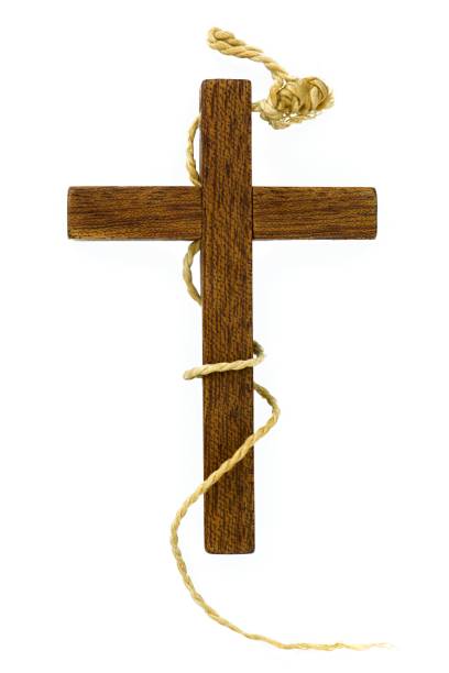 istock Old wooden cross with a rope turned around, isolated on white 693699486
