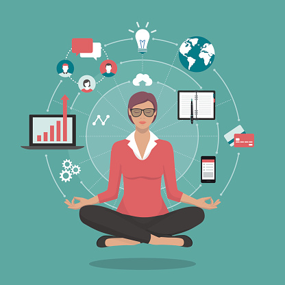 Businesswoman practicing mindfulness meditation, she is clearing her mind, releasing stressful toughts and expressing her potential; yoga and self consciousness concept
