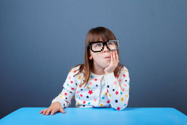 istock Cute 5 years old girl looking up 693699504