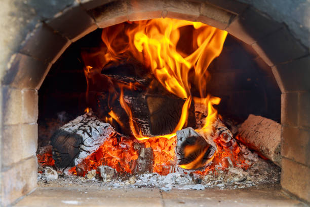 istock Pizzas baking in an open firewood oven 693718416