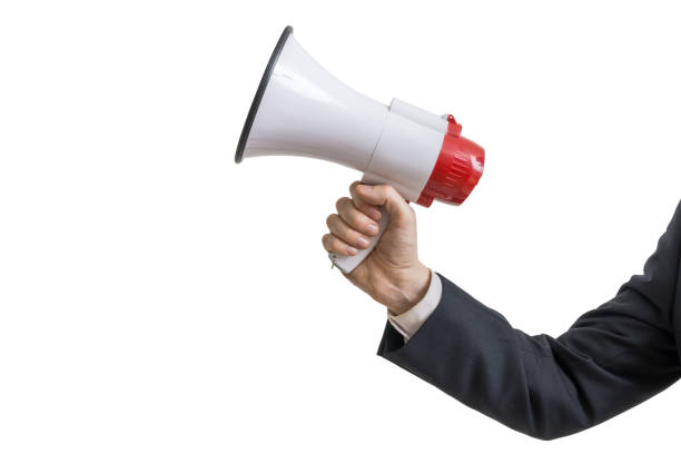 istock Announcement concept. Hand holds megaphone. Isolated on white background. 693722574