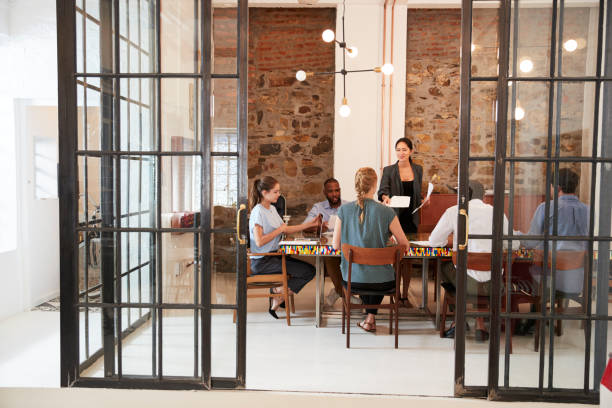 istock Creative business team in discussion in a meeting room 693723004