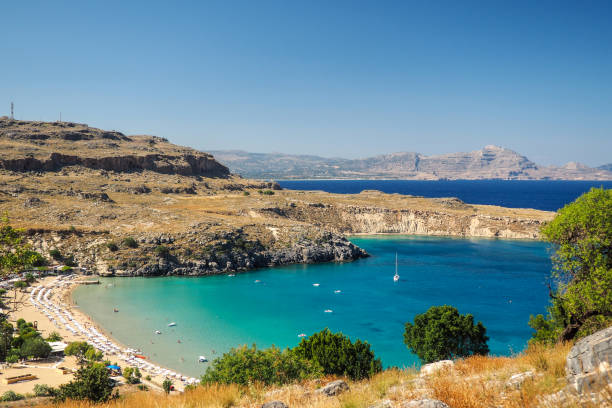 istock Sunny view on Lindos bay, Rhodes, Greece 693733388