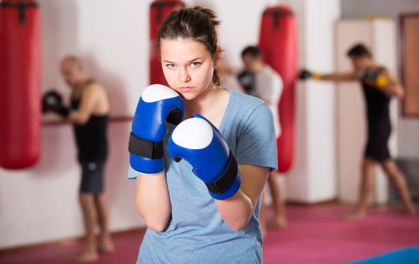 istock Sportwoman practicing boxing punches 693733622