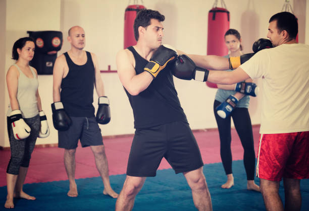 istock Sportsmen competing in boxing gloves 693733652