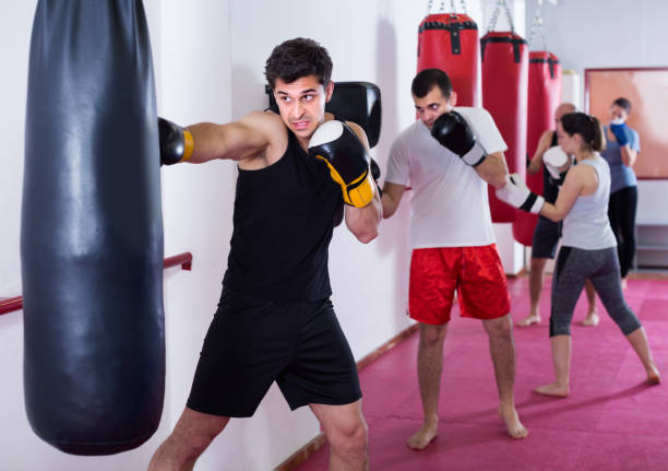 istock Young athlete is beating a boxing bag 693733718