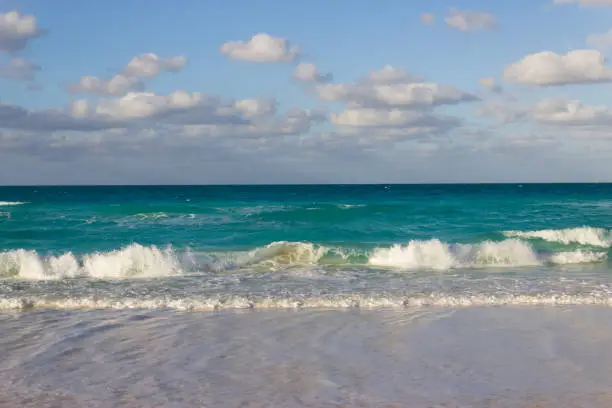 Small waves on the beach of the Caribbeans