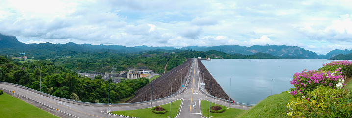 Ratchaprapha Dam at Khao Sok National Park with beautiful mountains on the horizon, Surat Thani Province, Thailand
